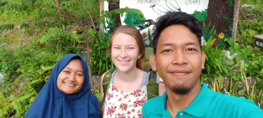 Photo of alumna Leah Derksen (middle) with FNPF Nusa Penida employees.