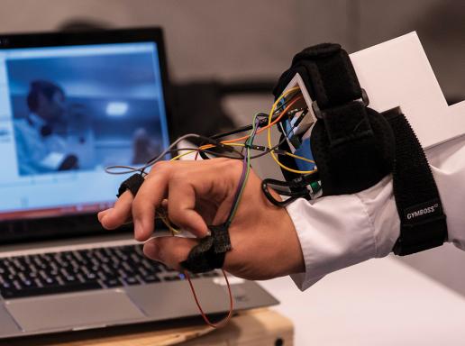Student project demo of an electronic device worn on the forearm