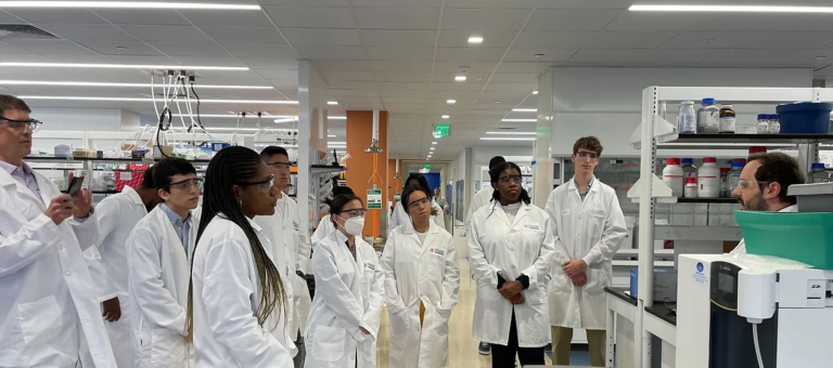 Students gather in lab for their REU experience