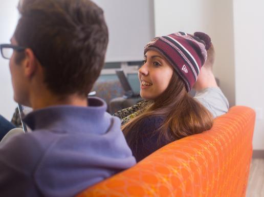 Commonwealth Honors College students sitting on an orange couch