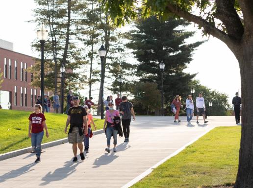 Students walking on campus during family weekend
