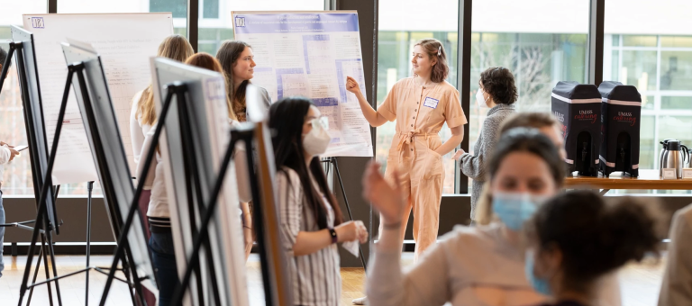 Students present research posters during Research Day