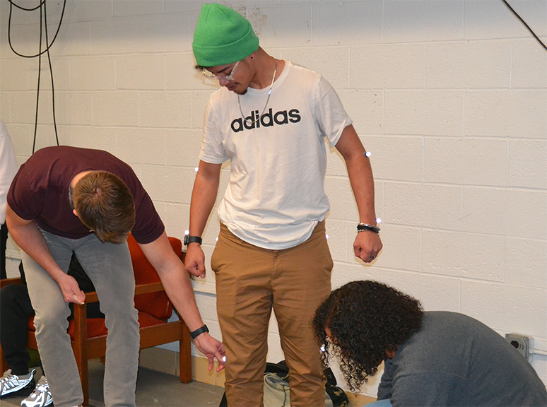 Kinesiology graduate students apply motion capture sensors to high school student