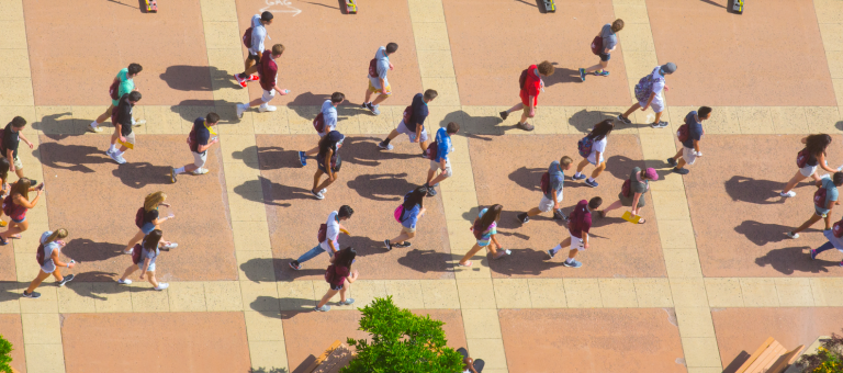 Aerial shot of students walking near the W.E.B. Du Bois Library