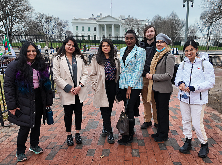 A photo of DACSS and SPP graduate students at the spring 2024 SBS Alumni Networking trip in Washington, DC